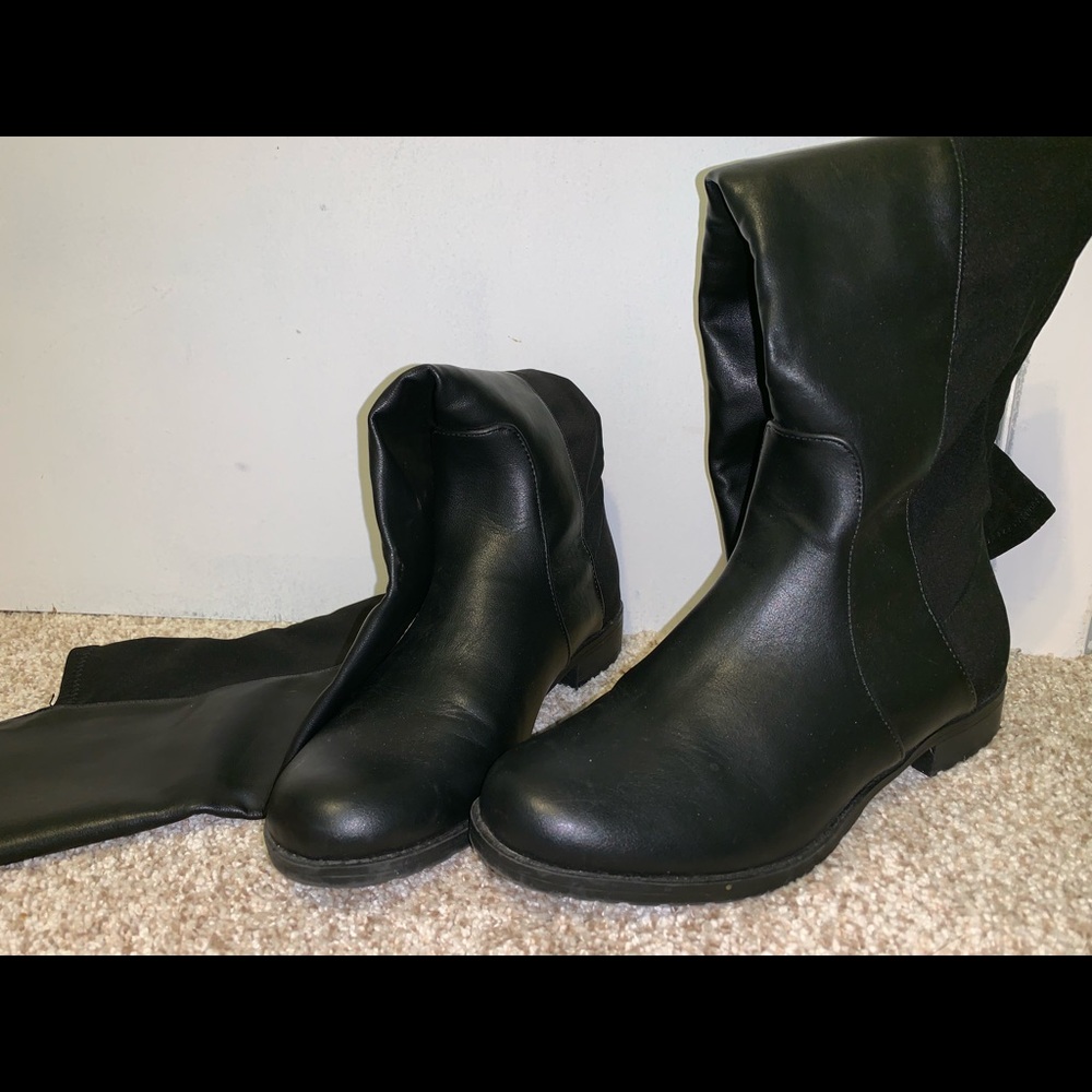 Over the knee black boots.
